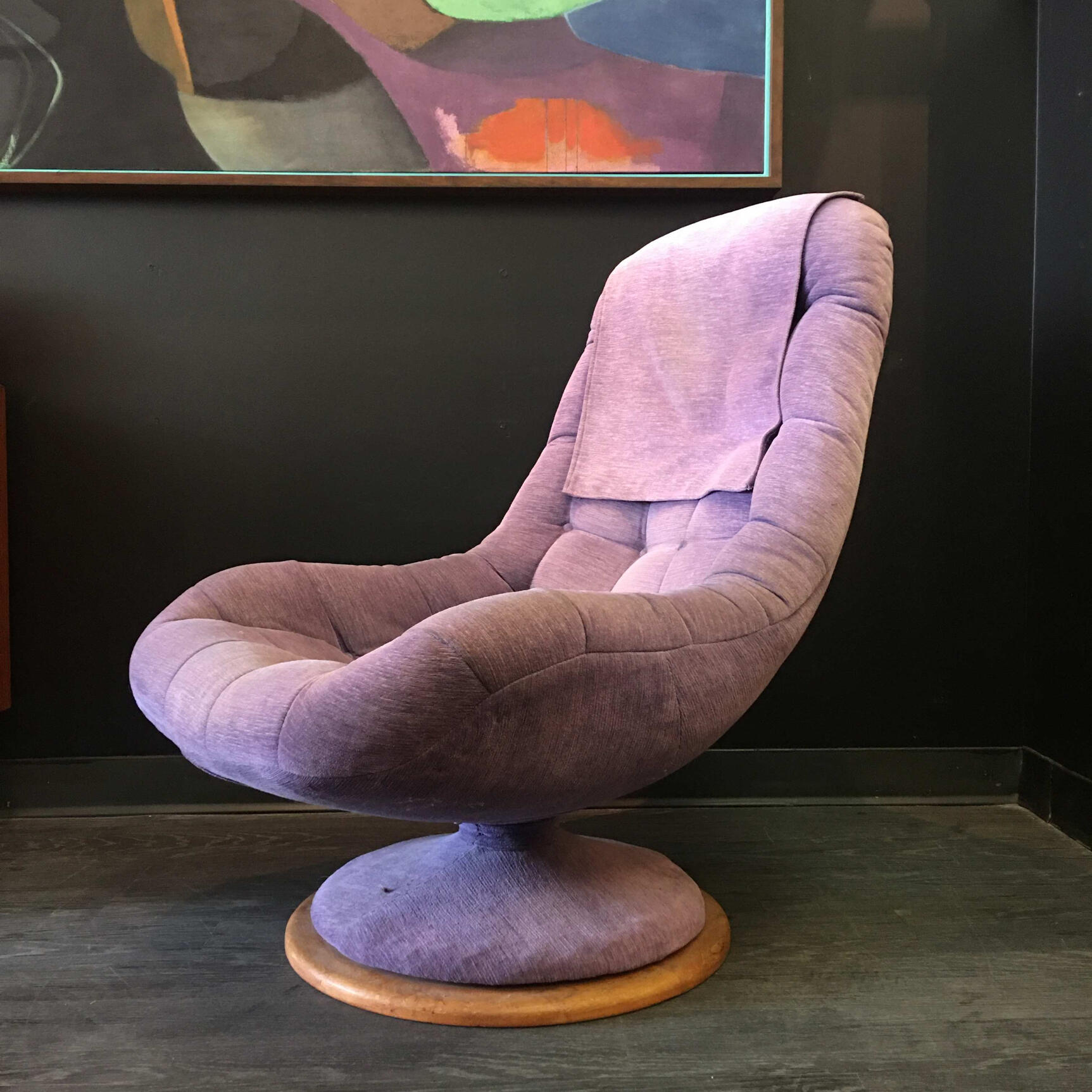 vintage purple swivel chair with abstract art in the background. Edmonton Vintage